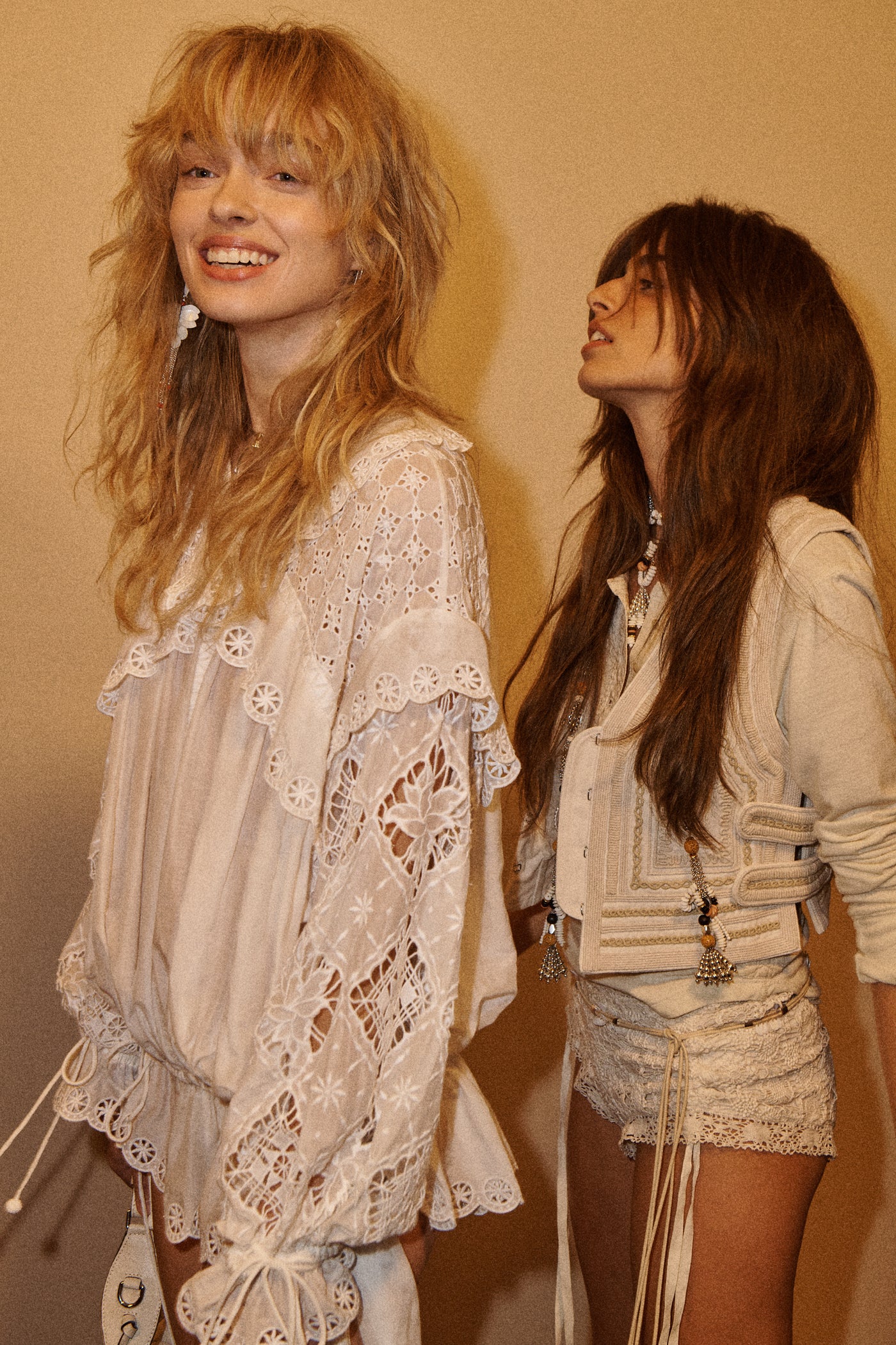 Models are wearing boho white set, a beige mini short and jacket with embroideries